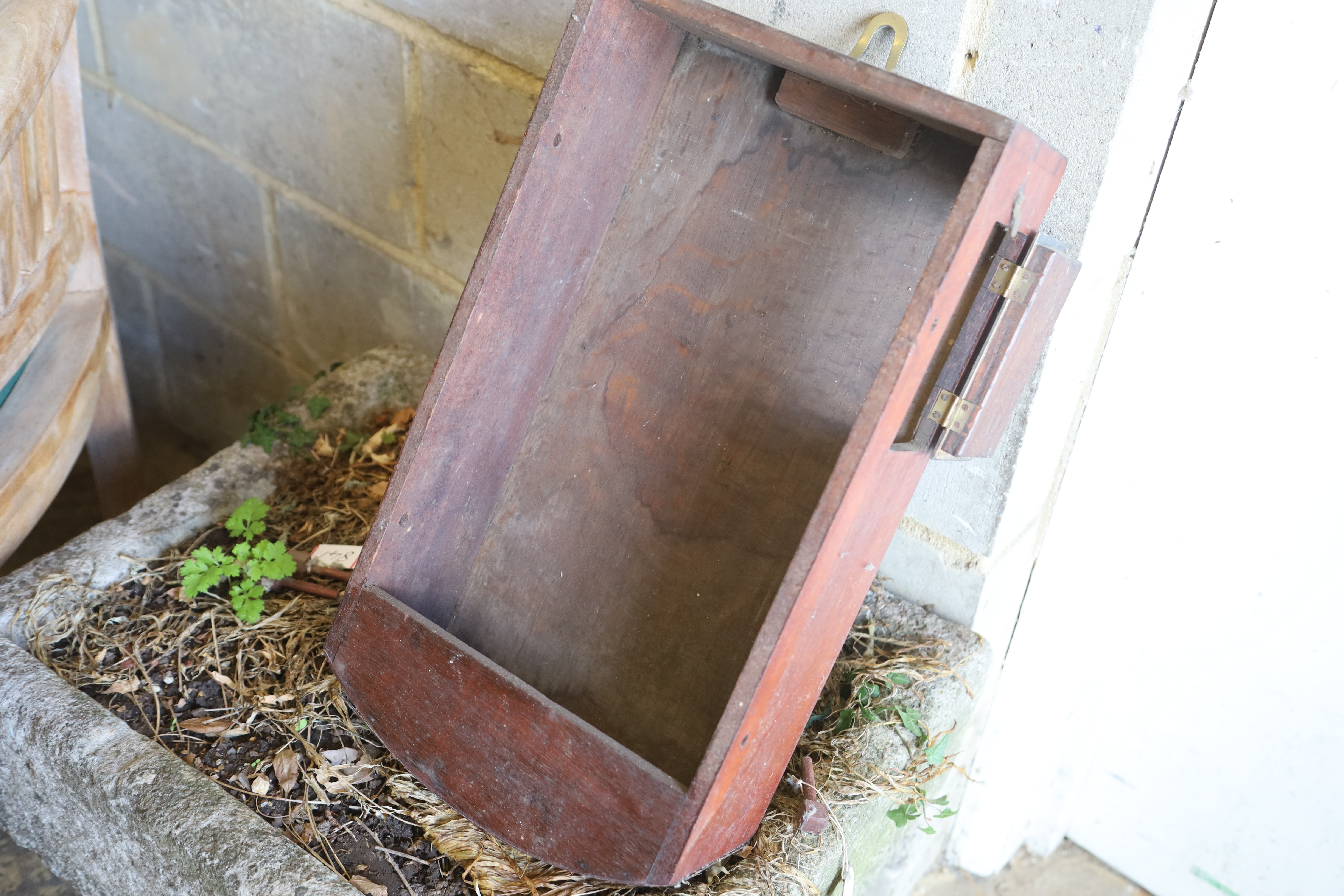 A large British Rail mahogany wall clock case, lacking movement, stamped 191SW, Diameter 57cm.